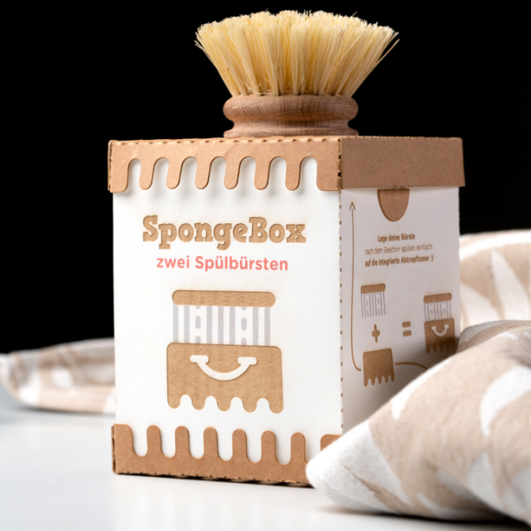Eine "Spongebox" mit Holzbürste darauf